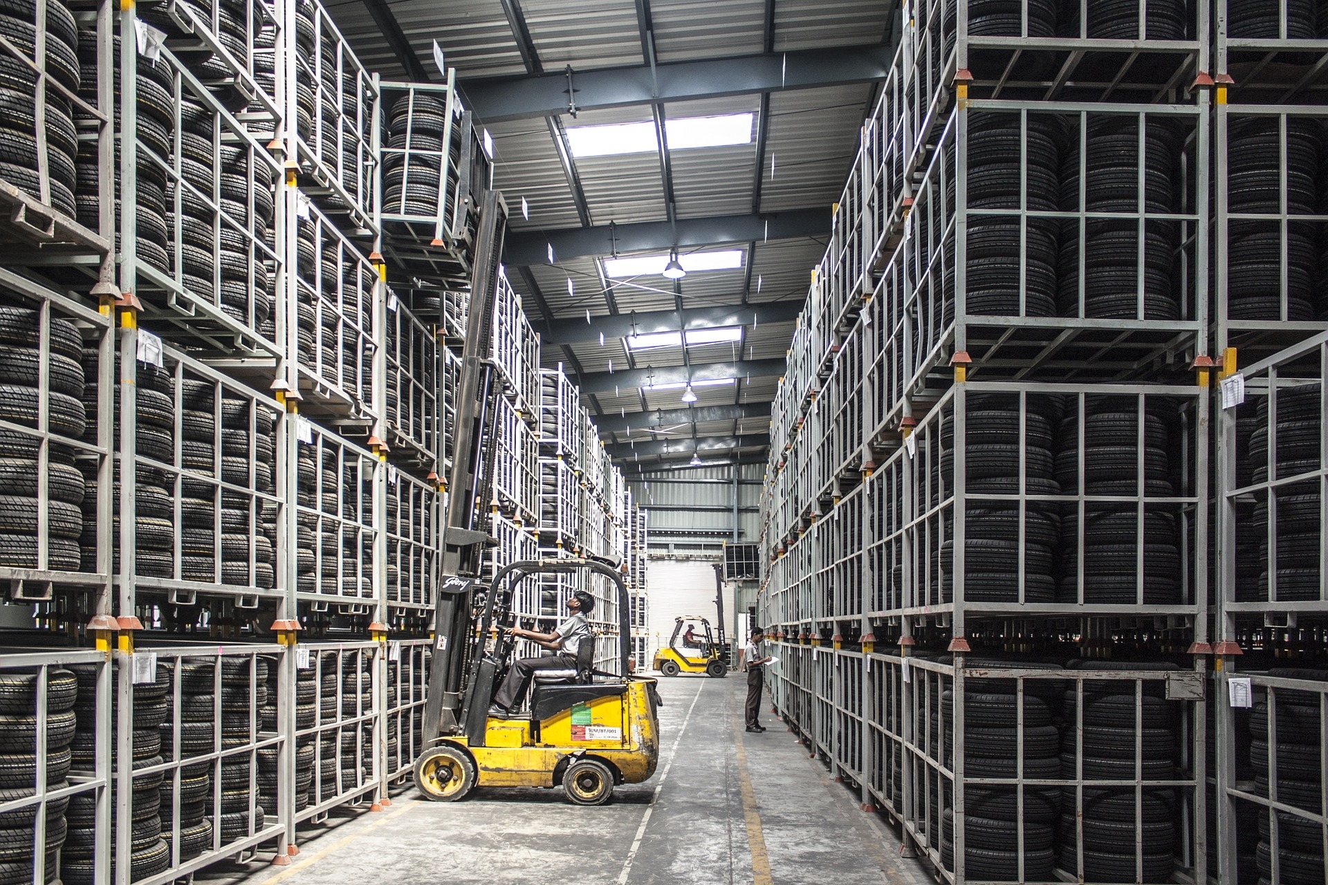 Yellow forklift in a tire warehouse
