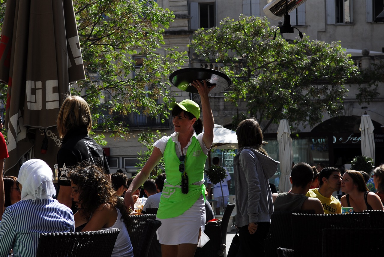 waitress in a green top and hat